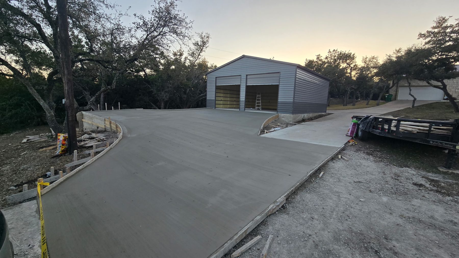 New driveway poured up to a garage