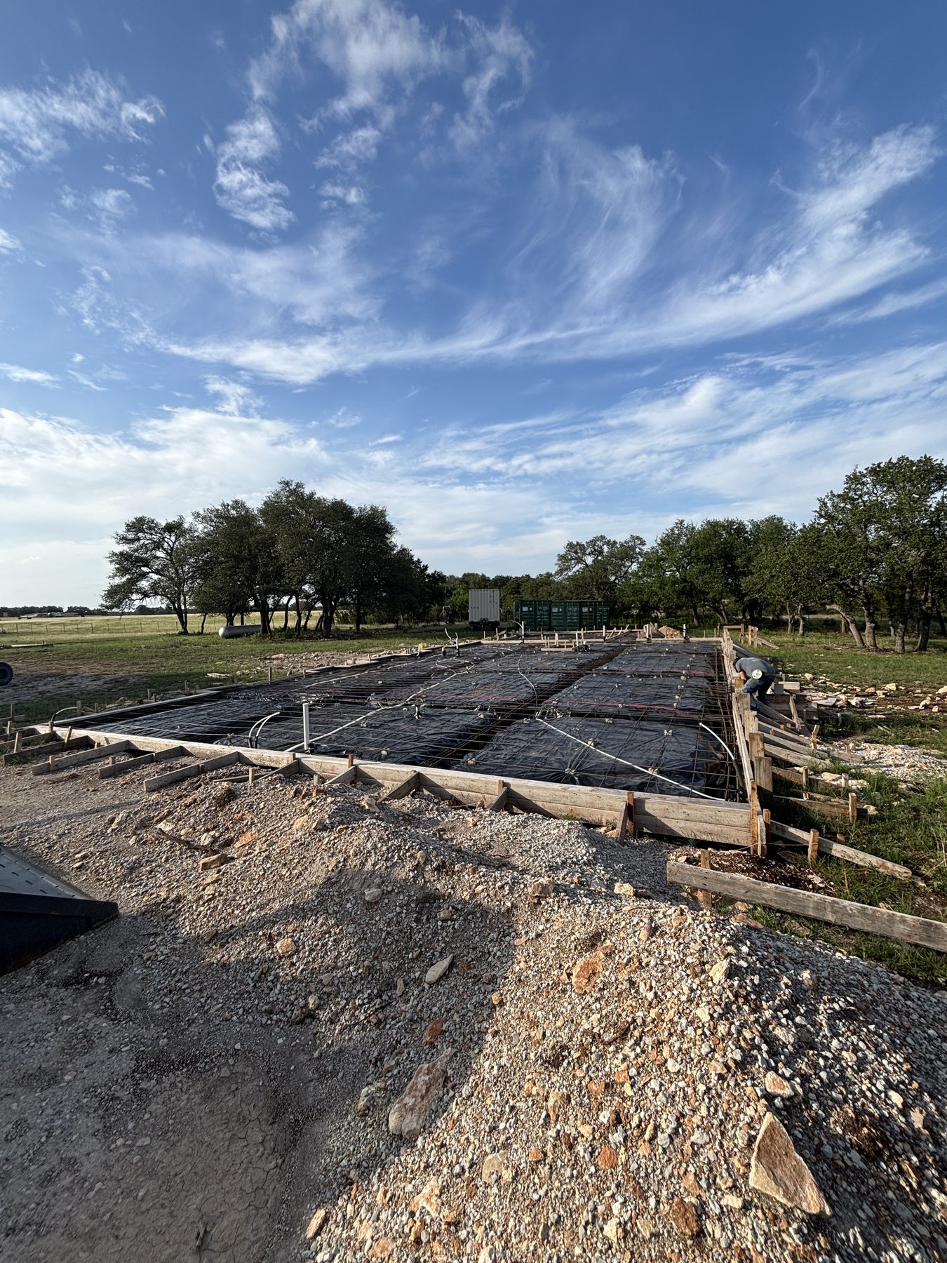 Foundation forms and steel on a hillside lot