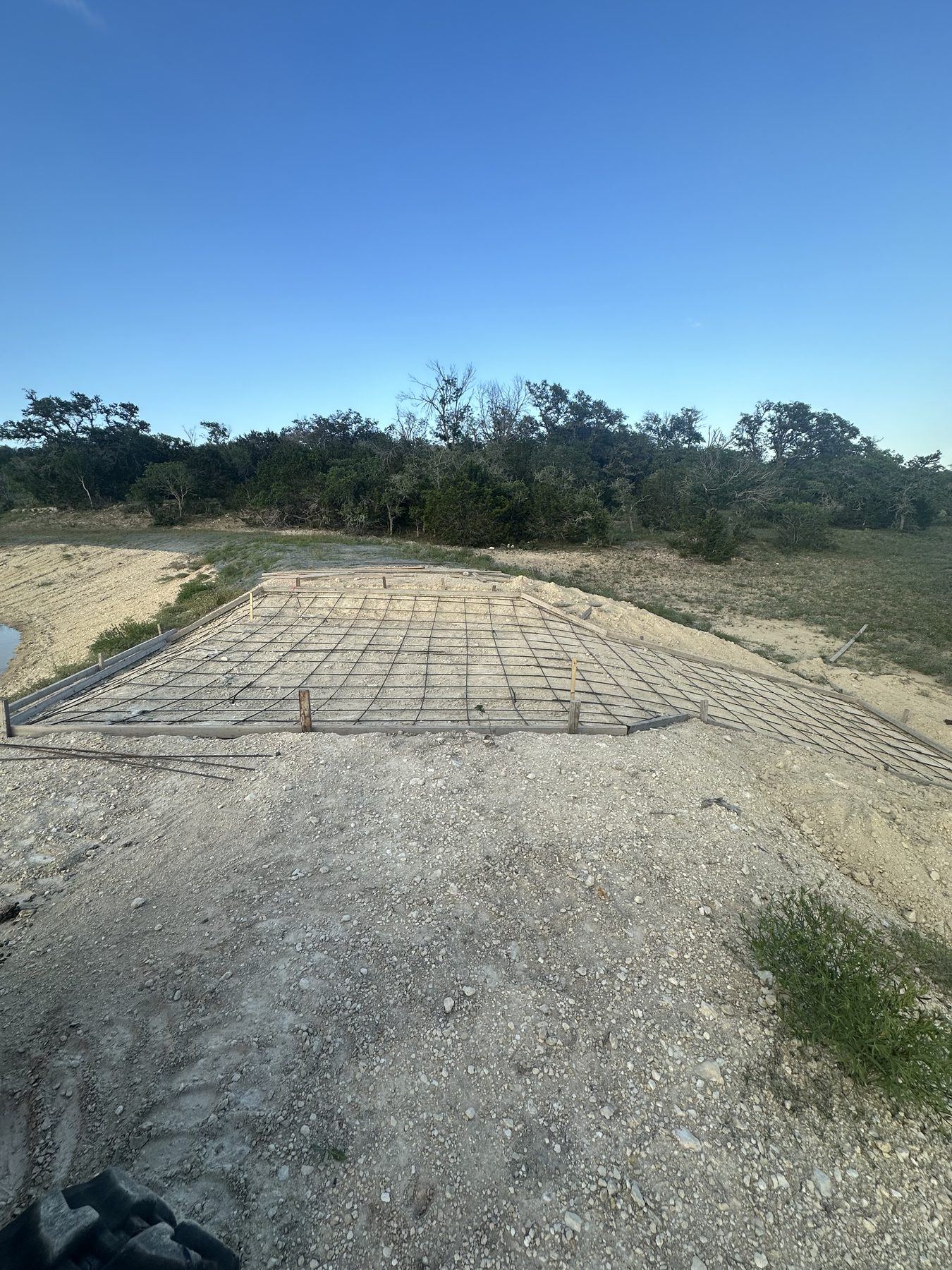 Rebar grid tied on a hillside pad
