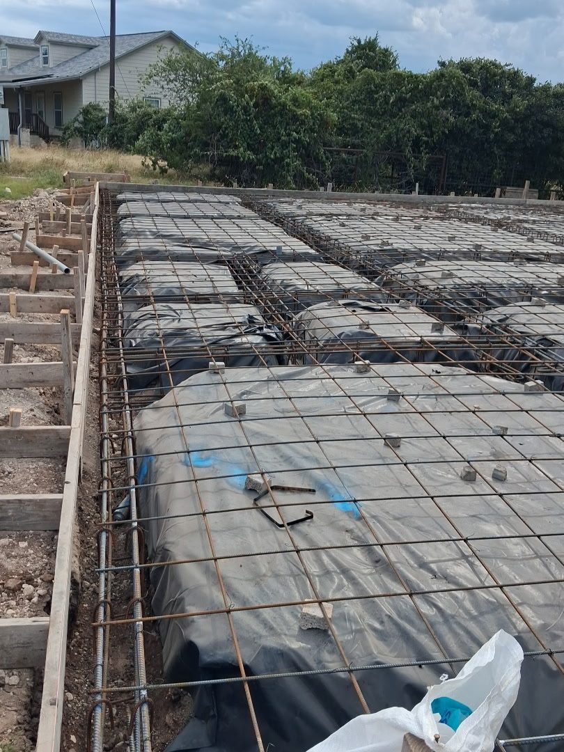 Rebar tied over the vapor barrier, ready to pour