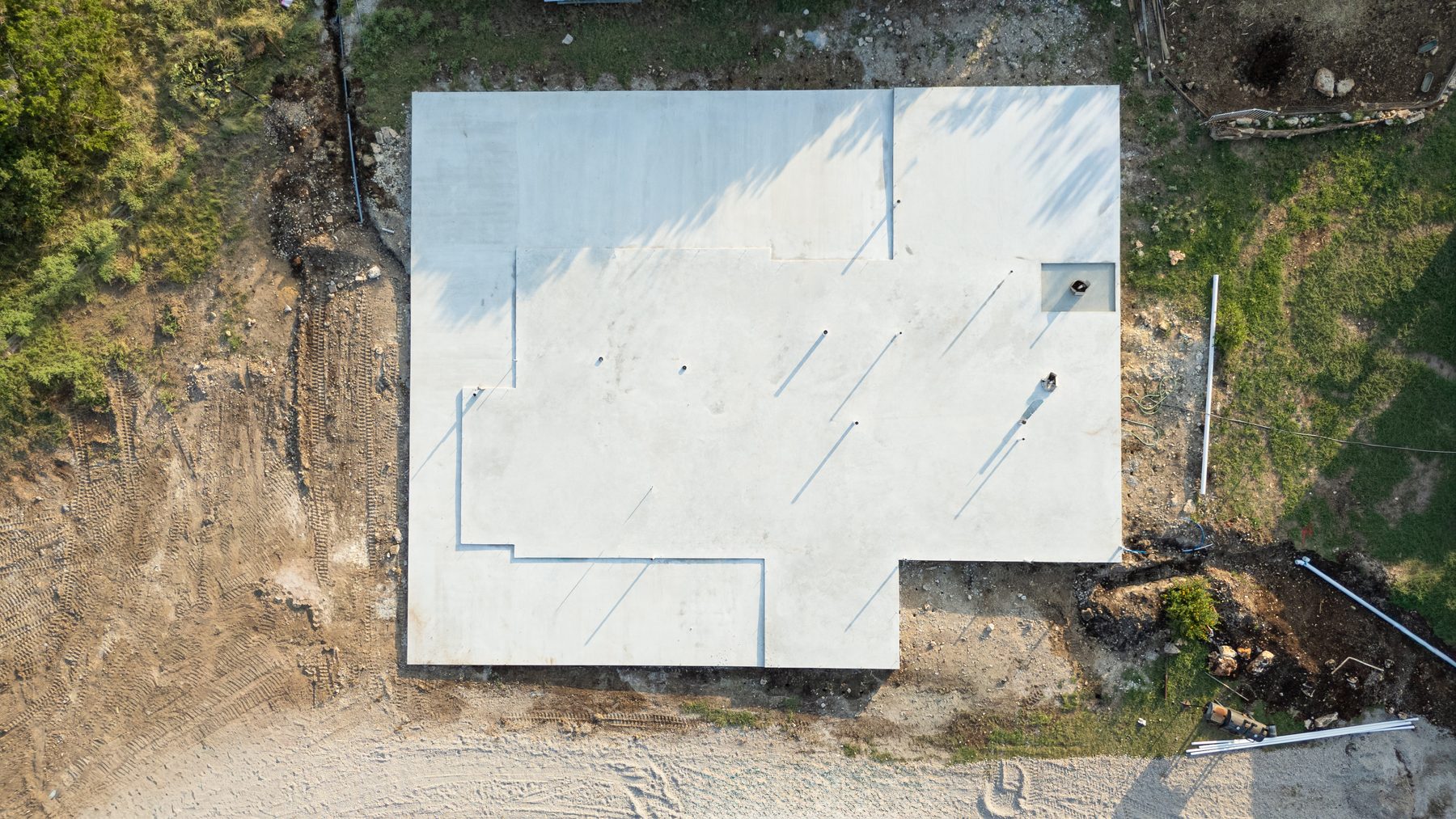 Top-down aerial of a finished slab foundation