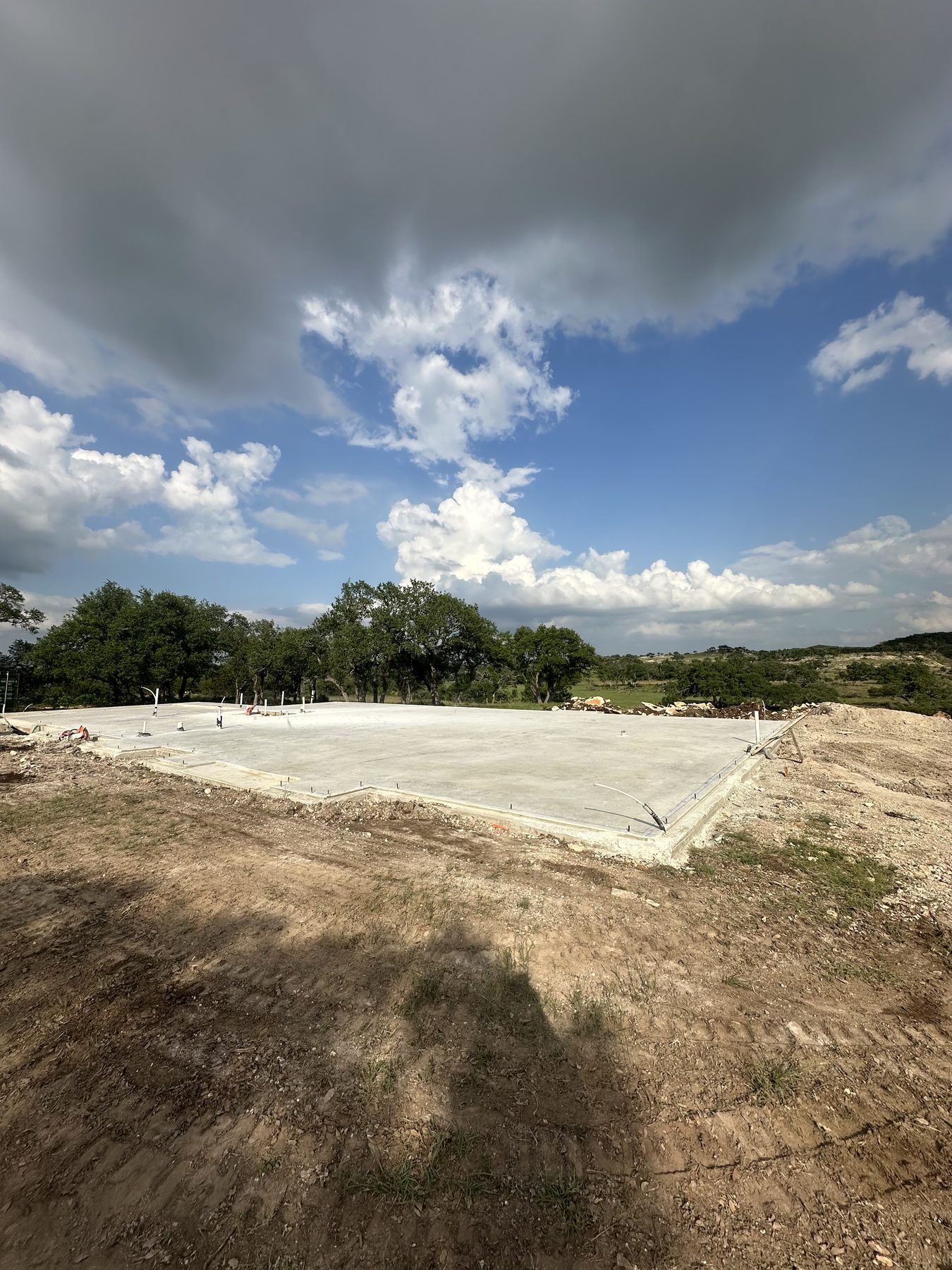 Slab foundation on a hilltop under a big sky